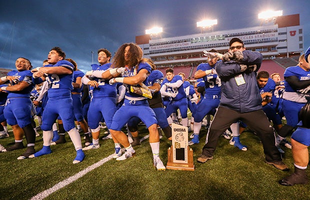 Bingham players and coaches celebrate winning the state championship by performing the Haka.