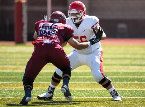 Regis Jesuit lineman Tim Lynott (white jersey) is one of the most highly regarded players in the state this season. The senior has committed to Colorado, one of five prep linemen who have decided to play in-state at Division I programs.