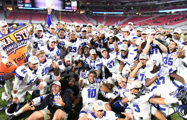 Chandler players celebrate their victory in the AIA Division 6A championship game at the University of Phoenix Stadium.