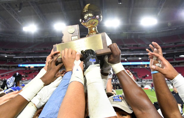 Chandler players hoist the state championship trophy.