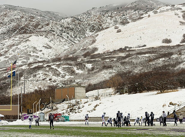 Snow-covered hills overlook the game between Rich (Randolph, Utah) and Duchesne (Utah).