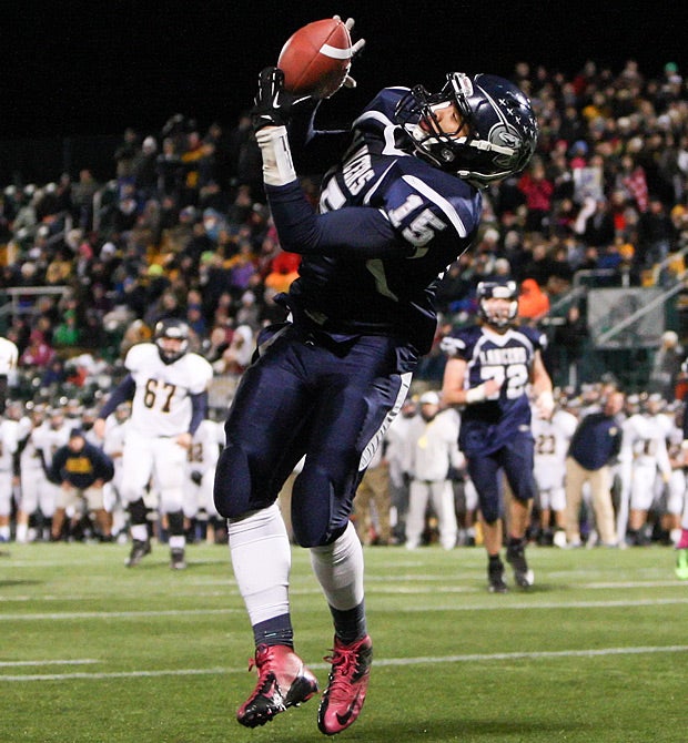 Jayshawn Pinkard of Eastridge (Rochester, N.Y.) pulls down a pass against Victor (N.Y.).