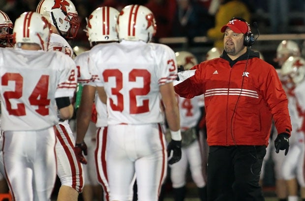 Kimberly, here with assistant Josh Heisler, huddled up often to slow down a potent Sun Prairie offense on Friday. The Papermakers gave up a first-quarter touchdown, but nothing the rest of the way en route to its 70th straight win.