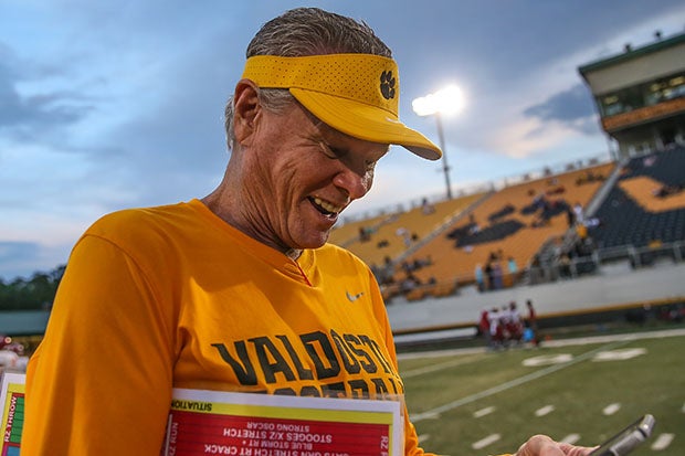 Rush Propst glances at his phone prior to a game in October against rival Lowndes.