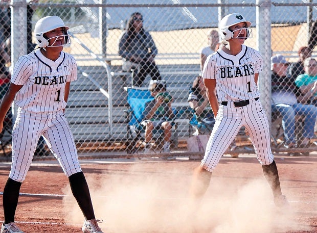 Kendall Bragg, right, hypes up her Basha team along with Gabriella Garcia. Bragg is hitting .500 with 11 home runs for the 14th-ranked Bears. (Photo: Michael Cazares)