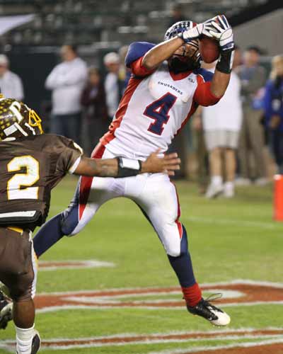 Kevin Roya (4) hauls in one of his two TD passes.