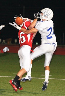 A Jefferson City defender knocks
the ball away from Geoff Kearns (24)