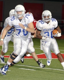 Strong blocking like this from Christian
Eatherly (70) for Michael Rose
keyed Rockhurst's comeback. 