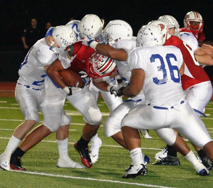 Rockhurst's Trey Randle (36) leads a strong second-half defensive surge. 