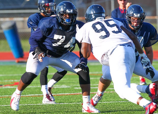 Offensive lineman Greg Little (left), shown during a recent spring game, is the nation's No. 1 junior recruit according to 247Sports.