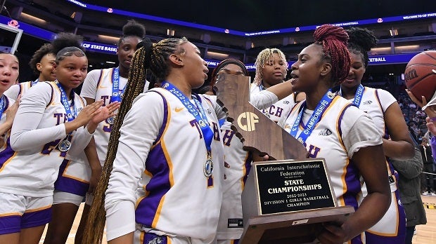 Oakland Tech players celebrate with the CIF Division I trophy, their third straight championship. The Bulldogs won the Division III last year and Division IV in 2019. (Photo: David Steutel)