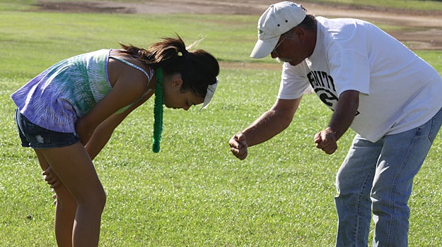 Coach Richard Boyd working on the perfect swing.