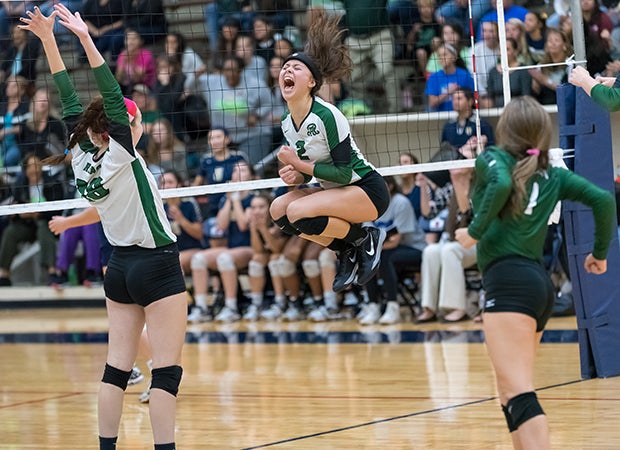 Tori Hinojoa of Reagan (Texas) leaps while celebrating the final point in the second game against O'Connor in a UIL 6A regional quarterfinal playoff match.