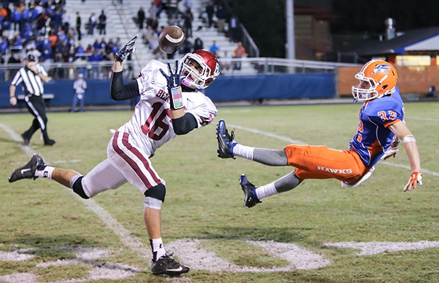 A Brookland-Cayce (S.C.) receiver makes a catch in front of a Hanahan defender during a SCHSL Class AAA first round playoff game.