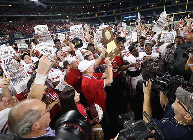 Carthage head coach Scott Surratt hoist the state championship trophy.