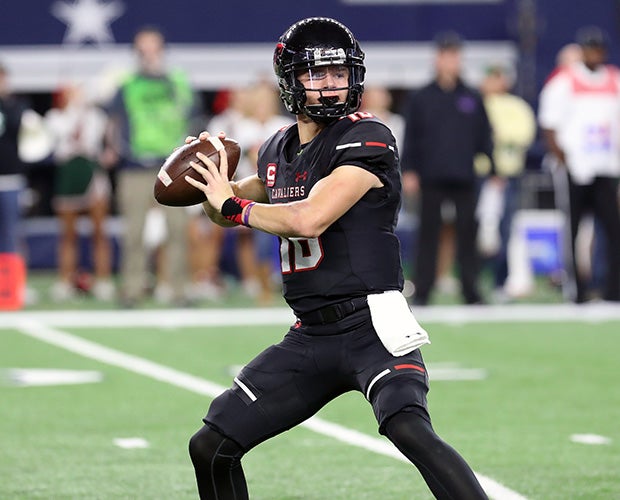 Lake Travis quarterback Charlie Brewer drops back to pass during Saturday's UIL 6A Division I championship game at AT&T Stadiun.