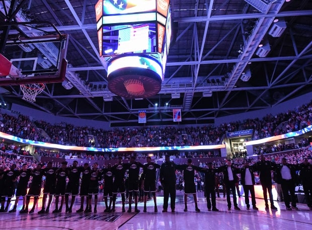 Memphis East (Tenn.) players and coaches stand for the National Anthem in front of over 10,000 fans before the 2017 Bass Pro Shops Tournament of Champions title game.