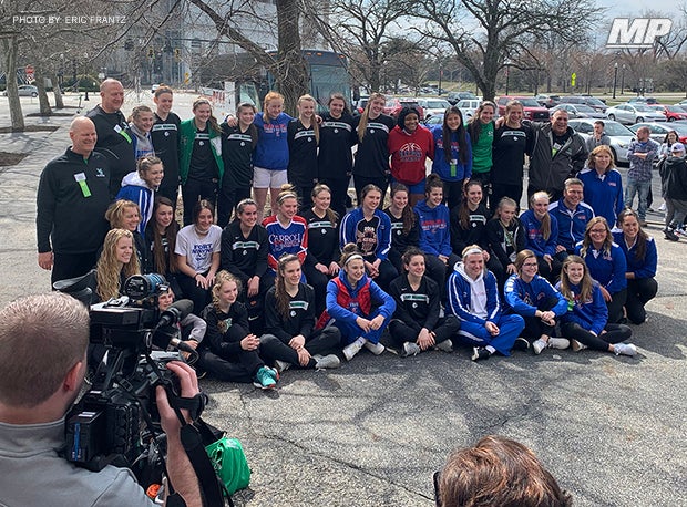 Carroll and West Branch high schools pose for a shot outside St. John Arena last year after their OHSAA Division II state semifinal was postponed.