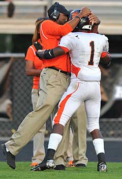 Lamar Parker celebrates with aWashington coach.