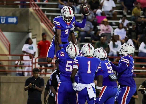 Duncanville wide receiver Emmanuel Ellison is lifted in the air in celebration after a first-half touchdown catch in the Panthers' win over rival DeSoto. Ellison caught a pair of scoring strikes as quarterback Maximus The Great Denson tossed seven TDs. (PHOTO: Lynn Fern)