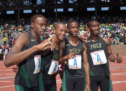 Poly poses after winning the Championship of the America 3,200 relay. From left: Myles Andrews, Christian Penn, Aaron Harris and Chris Hall.