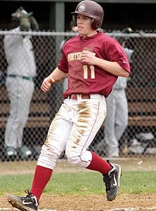 Matt Feeney scores the first runof the game.