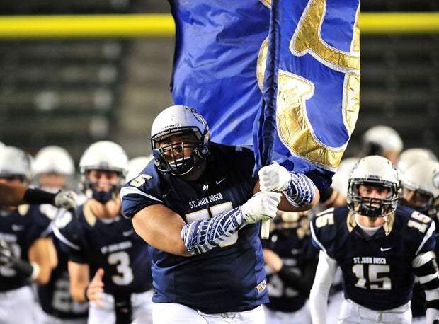 Damien Mama led St. John Bosco out of the locker room and along the line of scrimmage.