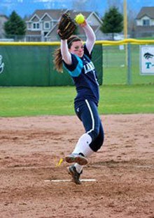 Casey Stangel's nonstop workouts haveher ready to rock as Lake City'spitching and hitting star.