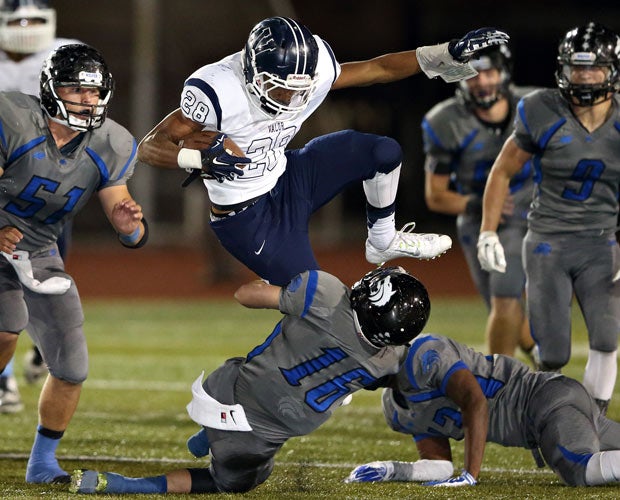 Valor Christian (Colo.) running back Stone Watson leaps over a Grandview defender.