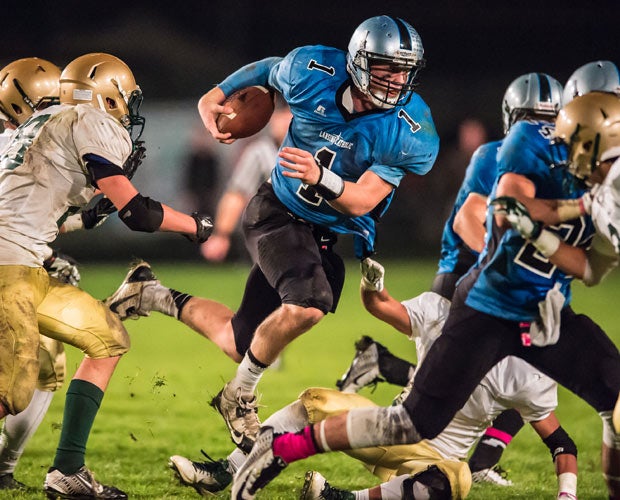 Catholic Central (Mich.) quarterback Tony Poljan carries during a game against St. Mary Catholic Central.