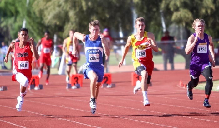 Luke Zuluaga (second from right, 2256) runs during the preliminaries at the AIA Track and Field Championships.