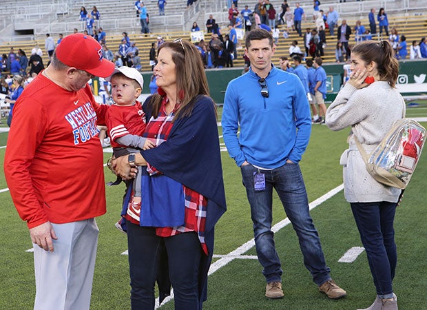 Todd and Riley along with their wives and Riley's youngest son, Landry, gather following Westlake's victory in last year's semifinals.