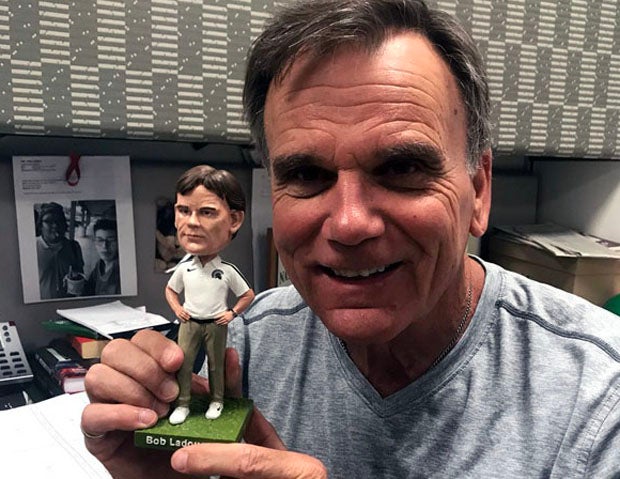 Bob Ladouceur when he first received one of his very own bobblehead.