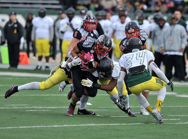 Ray Jackson III (32) is tackled. He led game with 139 yards rushing and a touchdown. 