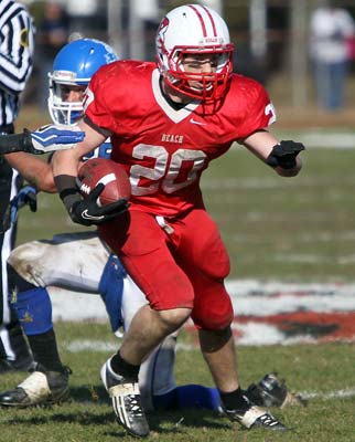 Junior running back Danny Tighe carries during the game
against Shore Regional on Thanksgiving Day.