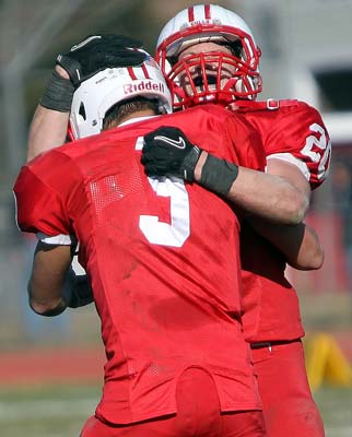 Quarterback Jake Fioretti (left) celebrates with teammate
Danny Tighe following their victory over Shore Regional.