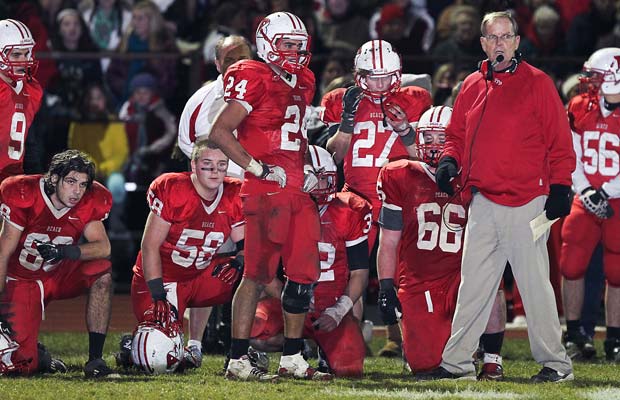 Coach John Wagner looks on from the sideline during their semifinal playoff game against Florence. 
