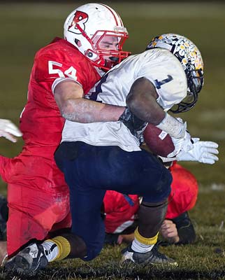 Linebacker Quinn Kusma makes a tackle in the semifinal
playoff game against visiting Florence.
