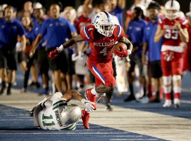Four-star Folsom running back Daniyel Ngata was bottled up most of the night, but broke free here. He finished with 66 yards rushing and a late touchdown.
