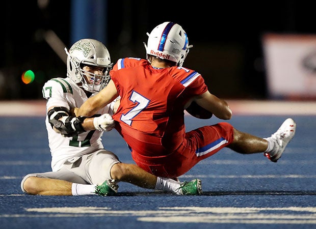 De La Salle defensive end Tanner Dougherty (17) with one of five sacks on Jake Reithmeier, who threw for 267 yards and three touchdowns. 