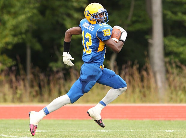 Brandon Anderson of Bacon Academy (Colchester, Conn.) pulls away from the defense.