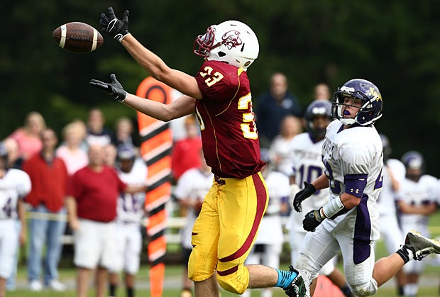 Jake Lareau of Windsor Locks/Suffield/East Granby (Windsor Locks, Conn.) attempts to make the catch against Ellington/Somers (Ellington, Conn.).