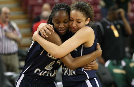 Sierra Canyon's Kennedy Burke (left) embraces Cheyanne Wallace following their team's first state championship win at Sleep Train Arena in Sacramento.