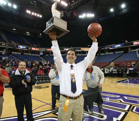 Pleasant Grove coach John DePonte displays the championship trophy following his team's historic win over Santa Monica to win the CIF State Division I title. 