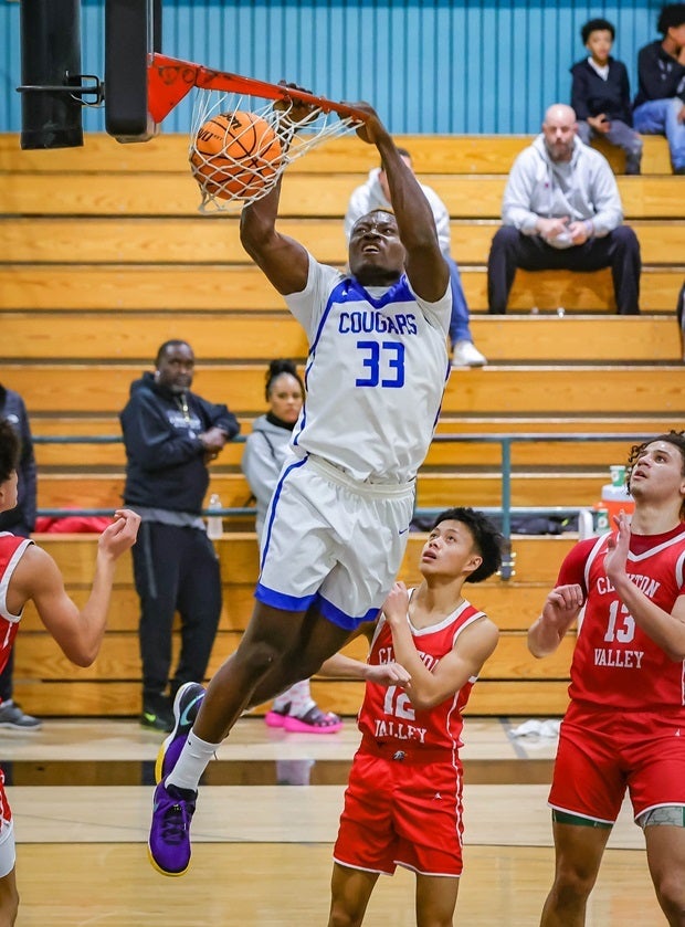 Capital Christian's Jephte Tambala dunks during a game against Clayton Valley Charter during the Sheldon Block Party Showcase. (Photo: Ralph Thompson)