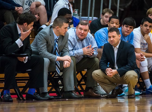 Head coach Rob Fulford (crouched on floor) and Huntington St. Joseph Prep are undefeated in 2014.