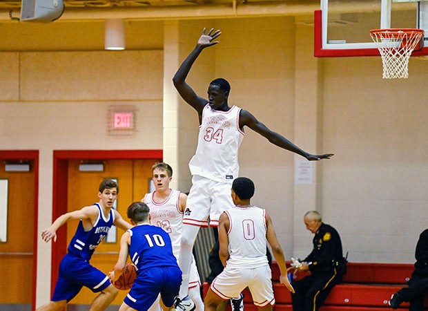 Center Bol Kuir towers over his opponents and teammates during a game earlier this season.