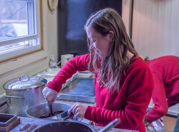 Chloe Dakers is wrapping up a prolific high school career in sports and academics. She also takes time to give back to her community, as shown here at the Pilgrim House.