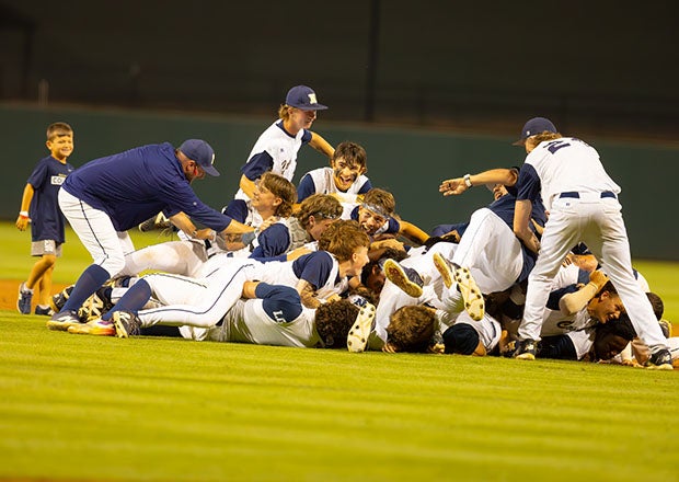 Newnan celebrates after finishing off Houston County in Georgia's AAAAA championship series. The Cougars finished the season 32-5 and won 29 of their last 30 games. (PHOTO: Corey Jones)