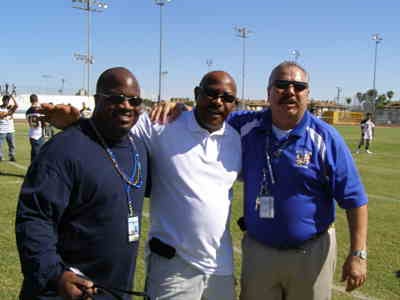 From left to right, Eric D. Kemp-athletic director, Coach Dansby and Principal Stephen A. Ybarra.